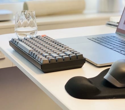 keyboard and a mobile phone on the table